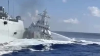 Moment huge Chinese ships smash into each other while chasing vessel