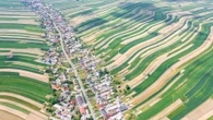 Inside bizarre village where all 6,000 residents live on SAME street