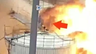 Terriying moment man dodges death as chemical tanks explode around him