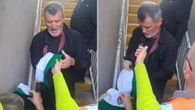 Roy Keane jokes 'I want to watch the match' as he signs autograph for young fan