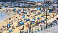 Thousands of Brits flock to beaches to soak up glorious rays as temps to hit 34C