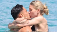 Mavropanos and girlfriend Lina frolic on Mykonos beach and kiss in sea