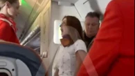Moment female plane passenger has mid-air meltdown demanding upgrade