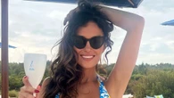 Albanian Laura Woods shows off stunning figure in colourful boob tube