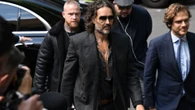 Russell Brand arrives at court accused of raping two women & sexual assault