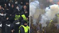 Europa League fans throw flares as riot police called in violent scenes