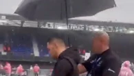 Boxer walks to ring with an UMBRELLA as rain pours down at Portman Road fight