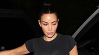 Kim Kardashian reveals nipple piercings in skintight, see-through shirt