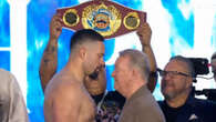 Frank Warren in face off with Parker before shoving the heavyweight boxer