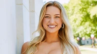 Sydney Thomas puts on busty display as she chugs Champagne at graduation