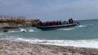 Brit tourists 'traumatised' as vid shows migrants swarming Spanish beach