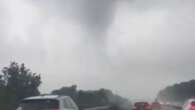 Moment drivers steer head-first into 'TORNADO' sweeping over road in Luton