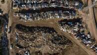 Pics show piles of wrecked cars in Spain after flash floods kill over 200