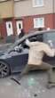 Terrifying moment driver is attacked by masked gang armed with HAMMERS