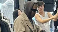 Kanye West is incognito in trench at Tokyo shop without Bianca Censori