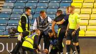 Carabao Cup clash suspended as pitch invader restrained by goalkeeping coach