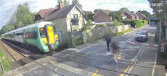 Watch girl run directly into path of speeding TRAIN on level crossing