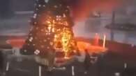 Moment Xmas tree is BURNED DOWN amid fears for Christians after Assad's fall