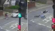 Moment driver ploughs into cyclist - before speeding off as he lay 'paralysed'