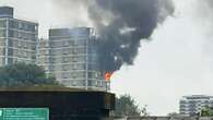 Huge blaze erupts at 15-floor tower block sparking dozens of evacuations