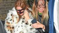 Isla Fisher looks all partied out as she takes a tumble outside celeb haunt