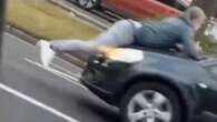 Road rage driver speeds off with rival on BONNET… who continues to film ordeal