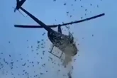 Helicóptero joga dólares em cidade no desejo final de milionário; veja