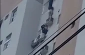 Em incêndio, mulher se pendura no ar-condicionado e salva mãe e filha; vídeo