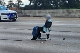 Woman pulls out a gun and a lawn chair during Texas standoff
