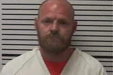 Husband accused of setting his wife of 10 years on fire