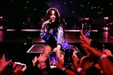 Billie Eilish violently dragged into barricade by fan in Miami