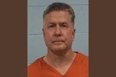 Lawyer accused of client murder after courthouse bomb threats