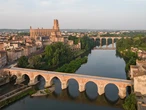 This stunning new bike and pedestrian crossing hangs off the side of an old railroad bridge