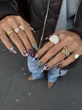Argyle Sweater Nails Are The Coziest Manicure Trend To Ring In Winter