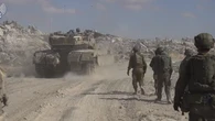 Israel llama a filas a miles de reservistas para varios frentes de combate y reforzará su ataque a Gaza, que deja 52.500 muertos