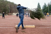 A woman lost her $823,000 injury claim after lawyers found a photo of her winning a Christmas tree-throwing competition