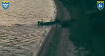 Ukraine launched a first-of-its-kind robotic amphibious assault, deploying a gun-toting robot from a drone boat