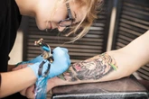 The tattoo industry is facing a reckoning, with customers fed up with bad artists, overpricing, and sexism