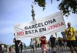 Protesters spray water guns at tourists in Barcelona as thousands rally against overtourism