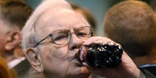 Warren Buffett defends his love of Coke and lack of exercise, noting that he's still here at 94
