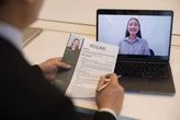 The best way to handle the 'Tell me about yourself' question in a job interview, and how to explain a layoff