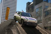 RJ Scaringe said there are 2 big reasons Rivian's new R2 doesn't look like a Tesla Model Y dupe