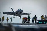 A US Navy pilot narrowly avoided crashing into the sea by as little as 16 feet after a 'catastrophic' failure aboard his aircraft carrier