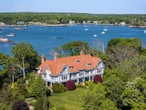 A Bridgewater exec is still trying to sell his private island. He cut its price &mdash; and threw in a mainland house with a dock.