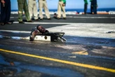 Here's why it's an aircraft carrier tradition to catapult a pair of boots