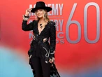 Lainey Wilson is a modern queen of country. Here's how her signature bell-bottoms and cowboy-hat outfits have evolved.