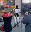 Tesla's Optimus robot hands out candy in Times Square