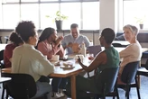 That free lunch your boss is offering might just be a way to get you back into the office