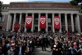 International universities are trying to poach Harvard students, promising 'unconditional offers.' One is touting its proximity to vacation destinations.