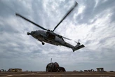 US Apache and Seahawk helicopters sank half a dozen Iranian small boats while clearing out threats around the Strait of Hormuz